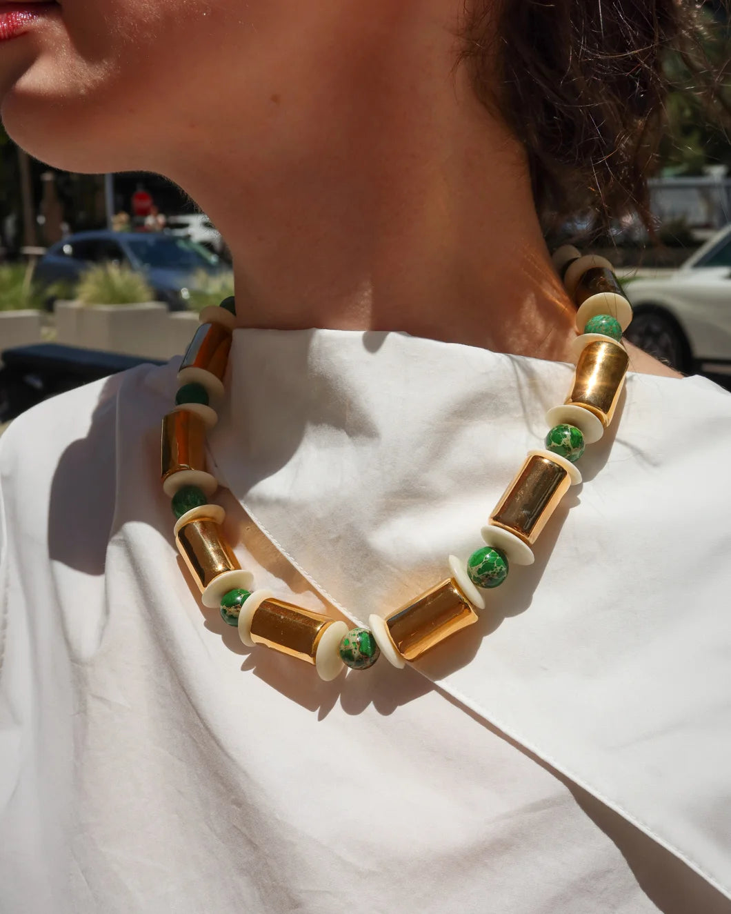HER NEW TRIBE Karat and Sea Sediment Stacked Necklace on figure front