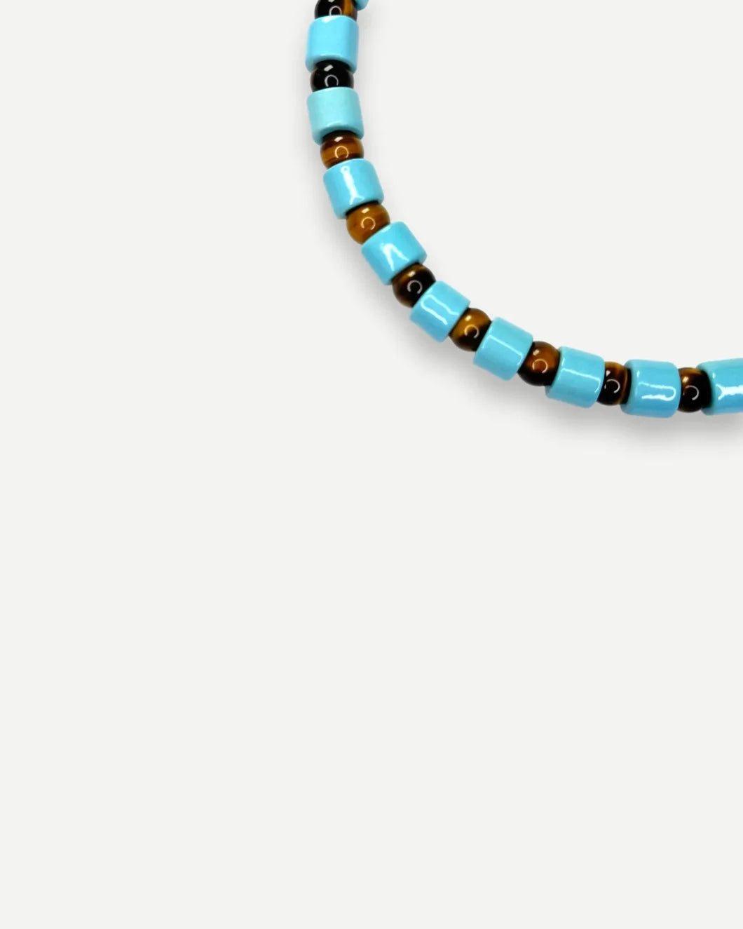 HER NEW TRIBE pool and tigers eye sundry detail