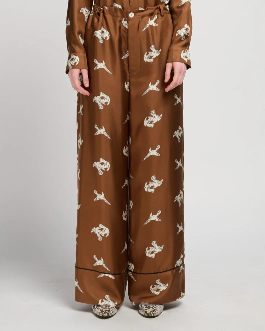 Marni raven print wide leg trousers brown on figure front