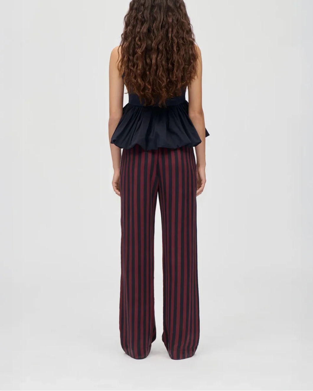 STINE GOYA elasticated long pants navy. burgundy wallpaper stripes on figure back
