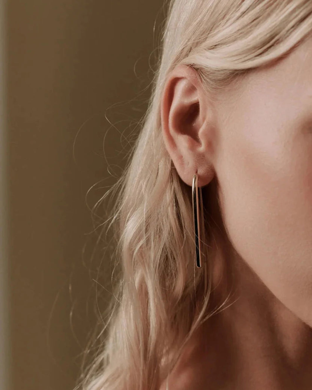 THEIR mini pin earrings gold on figure front