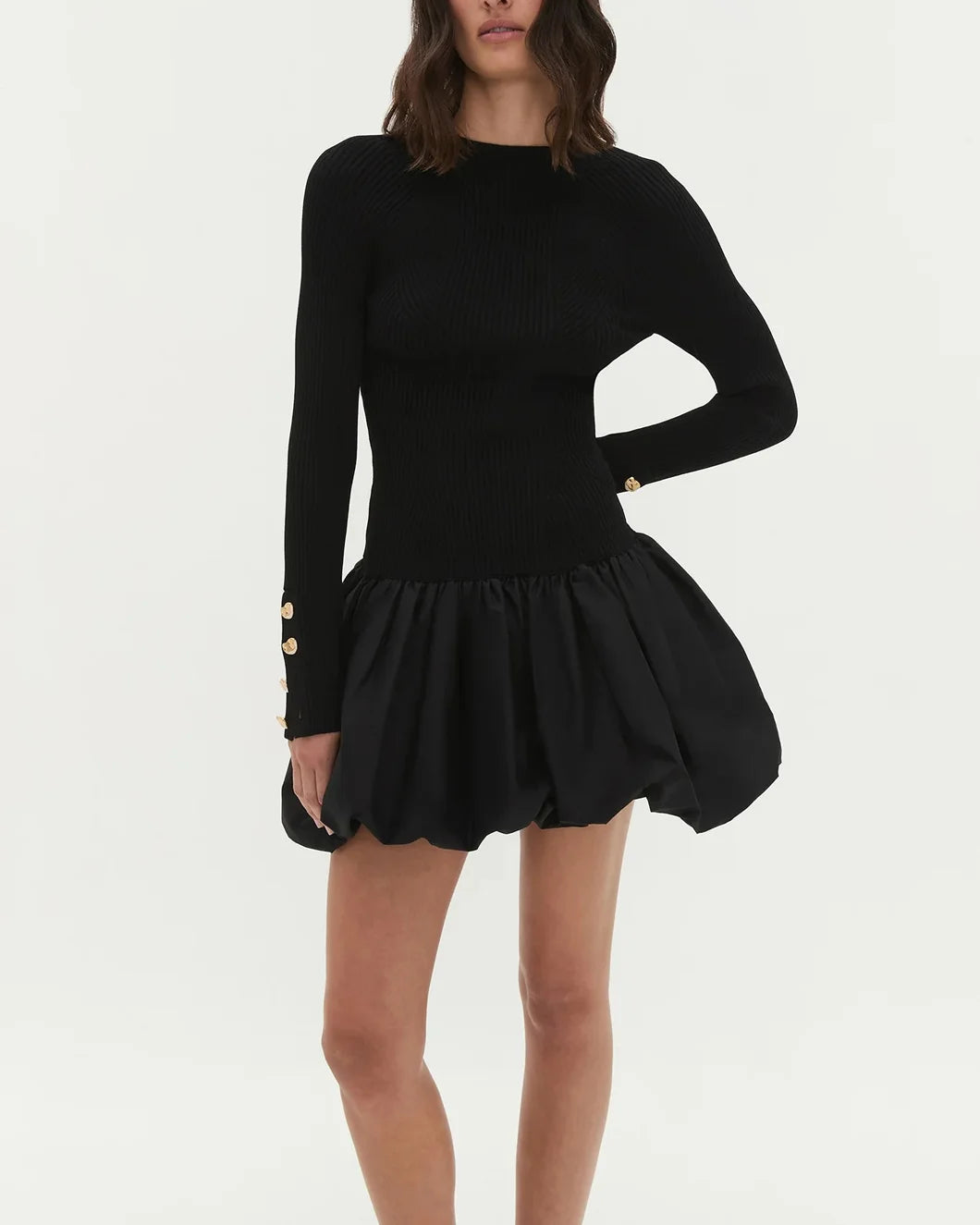 aje Moonlight Knit Mini Dress bubble skirt black on model front