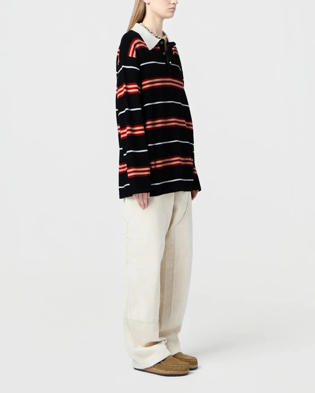 long sleeved striped rugby shirt in black, red, and cream cashmere by guest in residence on model side view