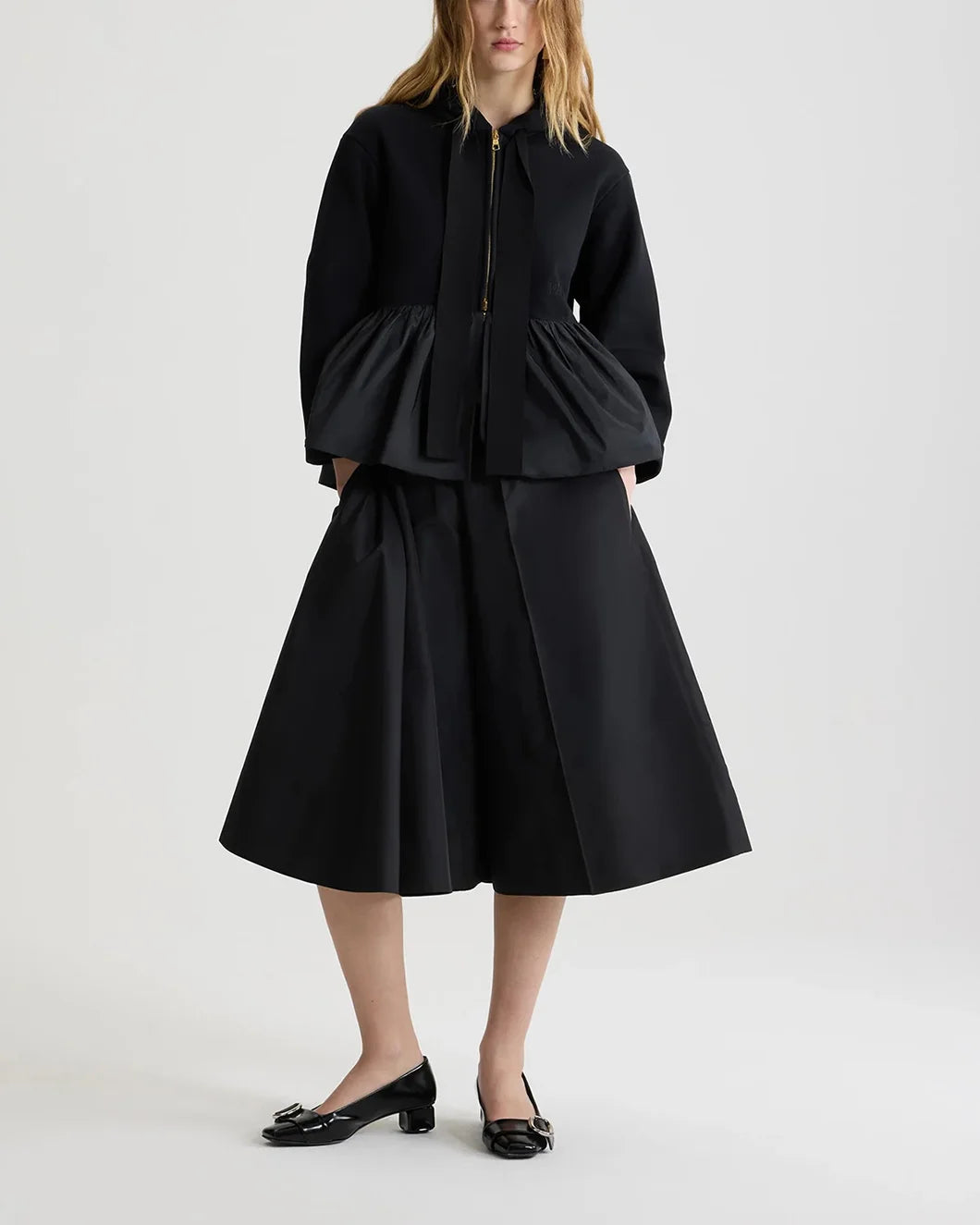 patou asymmetric bermuda shorts in black recycled faille on model front