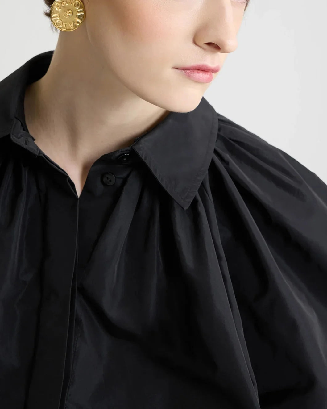 patou bubble blouse in recycled faille in black on model front collar detail