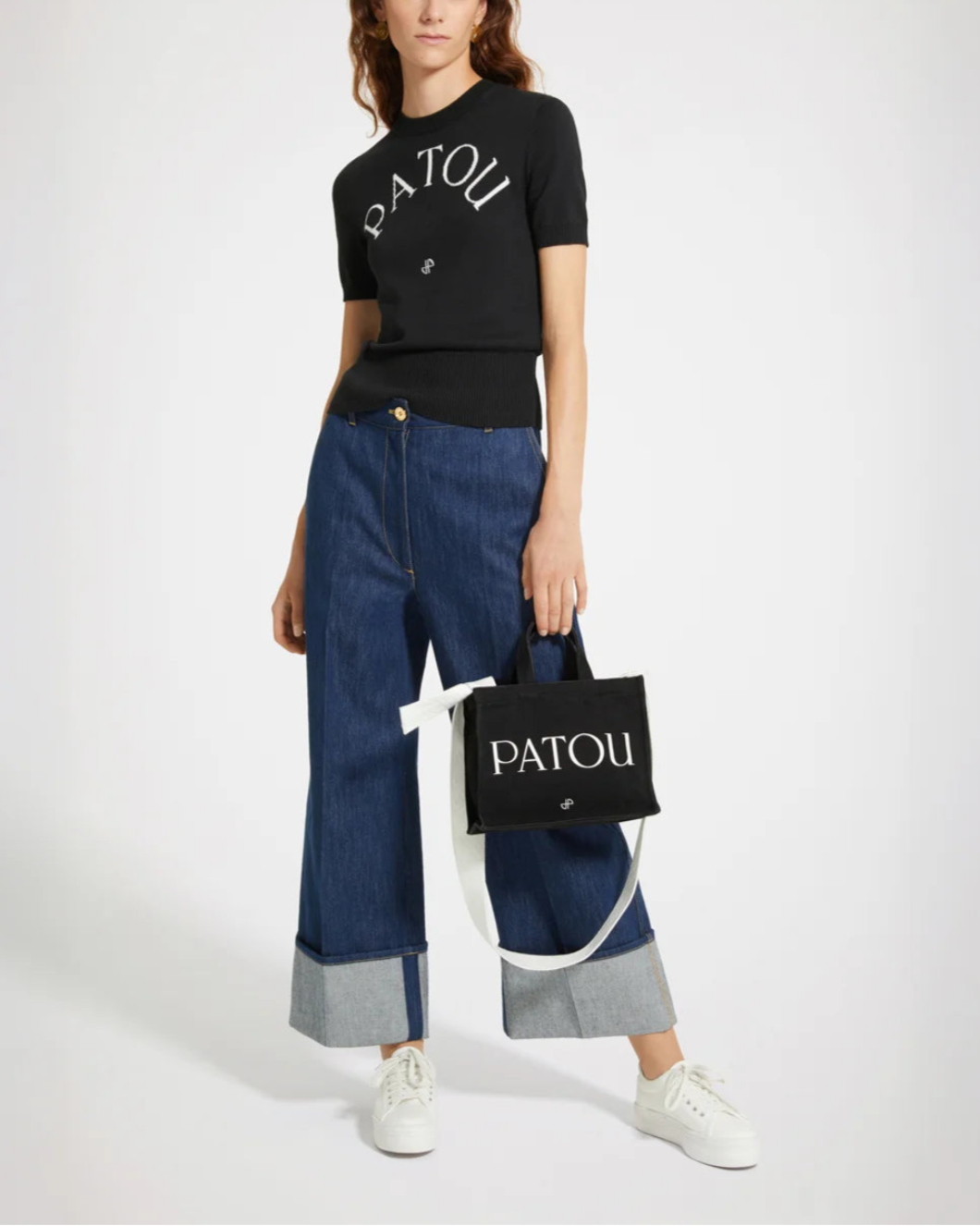 patou black jaquard knit top in eco friendly cotton blend with white logo on model front