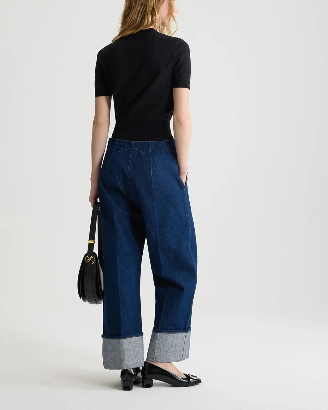 patou black jaquard knit top in eco friendly cotton blend with white logo on model back