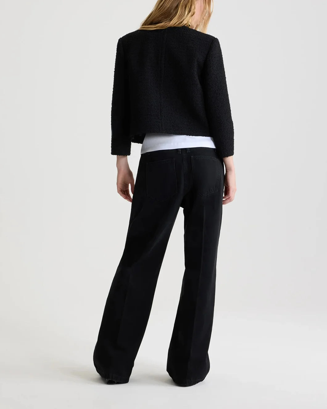 patou short collarless jacket in sustainable wool blend tweed in black on model back