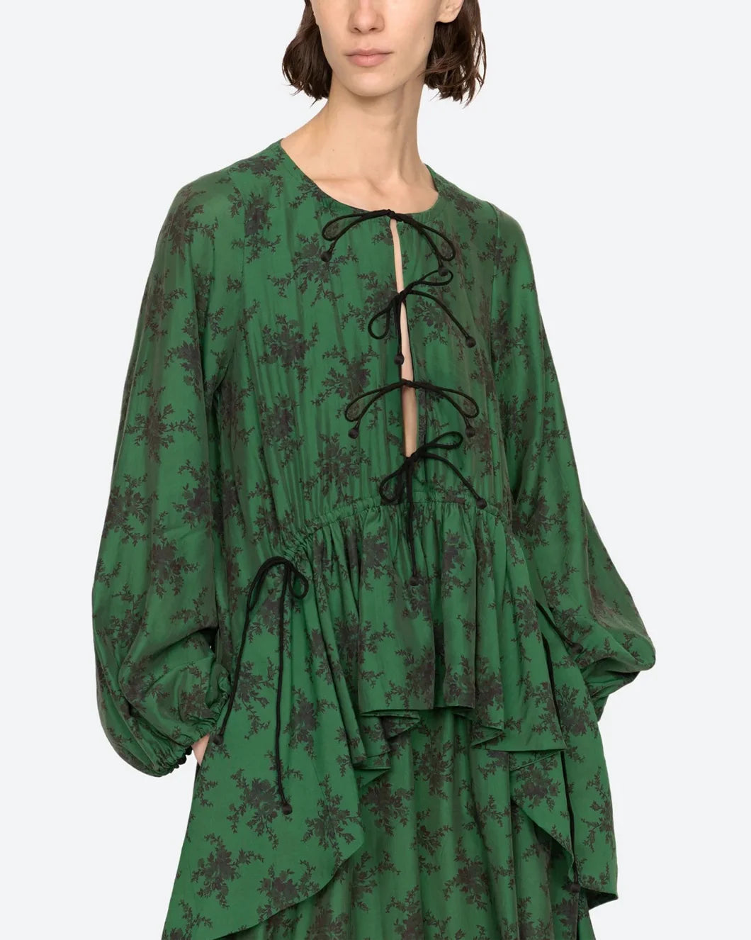 sea ny Joan Tie Front tiered Midi Dress green with black floral pattern on model front view