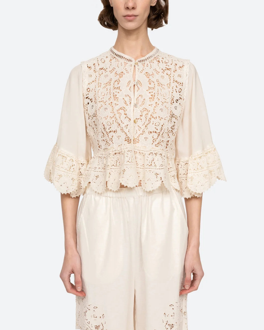 sea ny shanna lace three quarter sleeve top in cream on model front view
