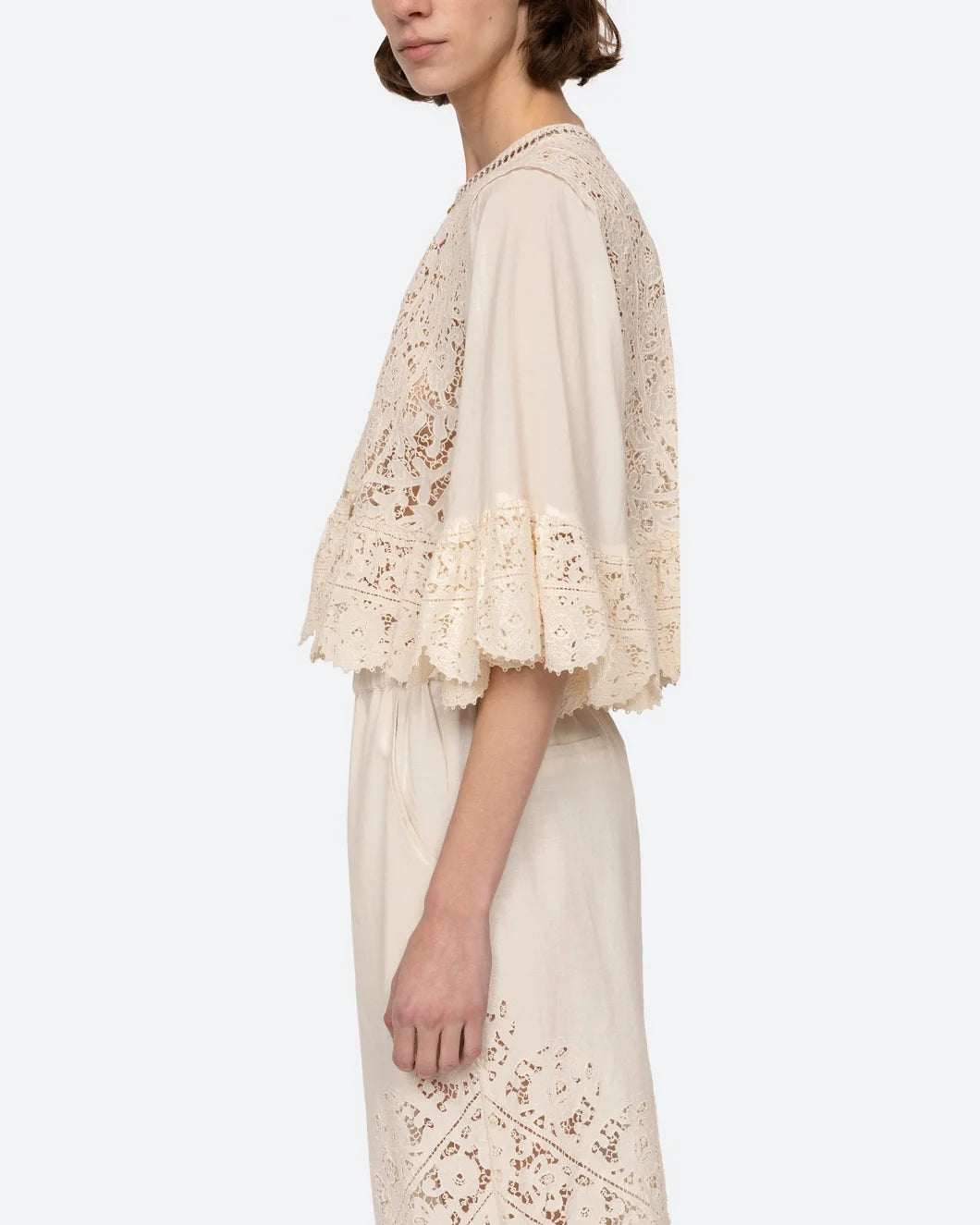 sea ny shanna lace three quarter sleeve scallop hem top in cream on model left side view