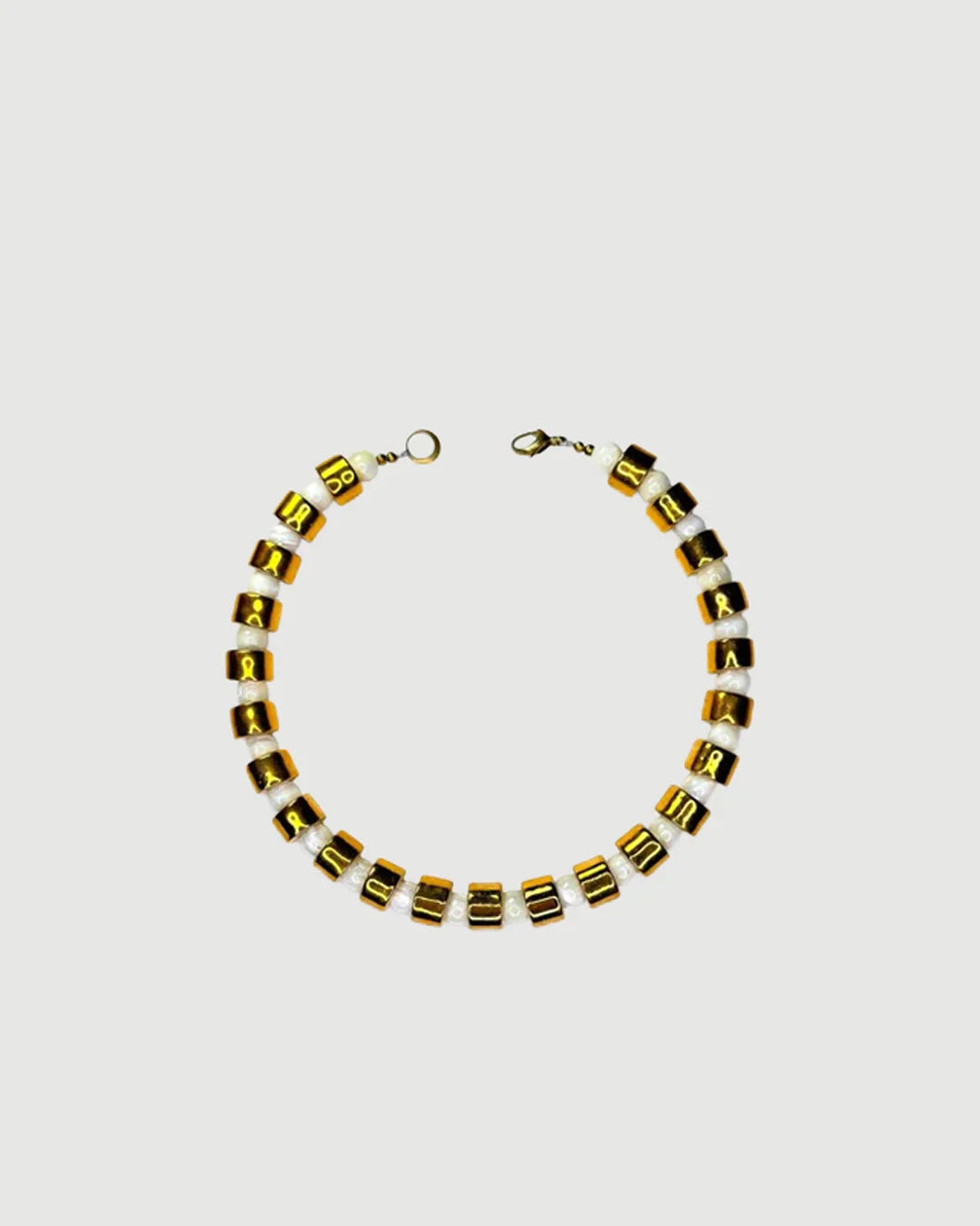 HER NEW TRIBE Karat & Mother of Pearl Sundry Bead Two Necklace isolated