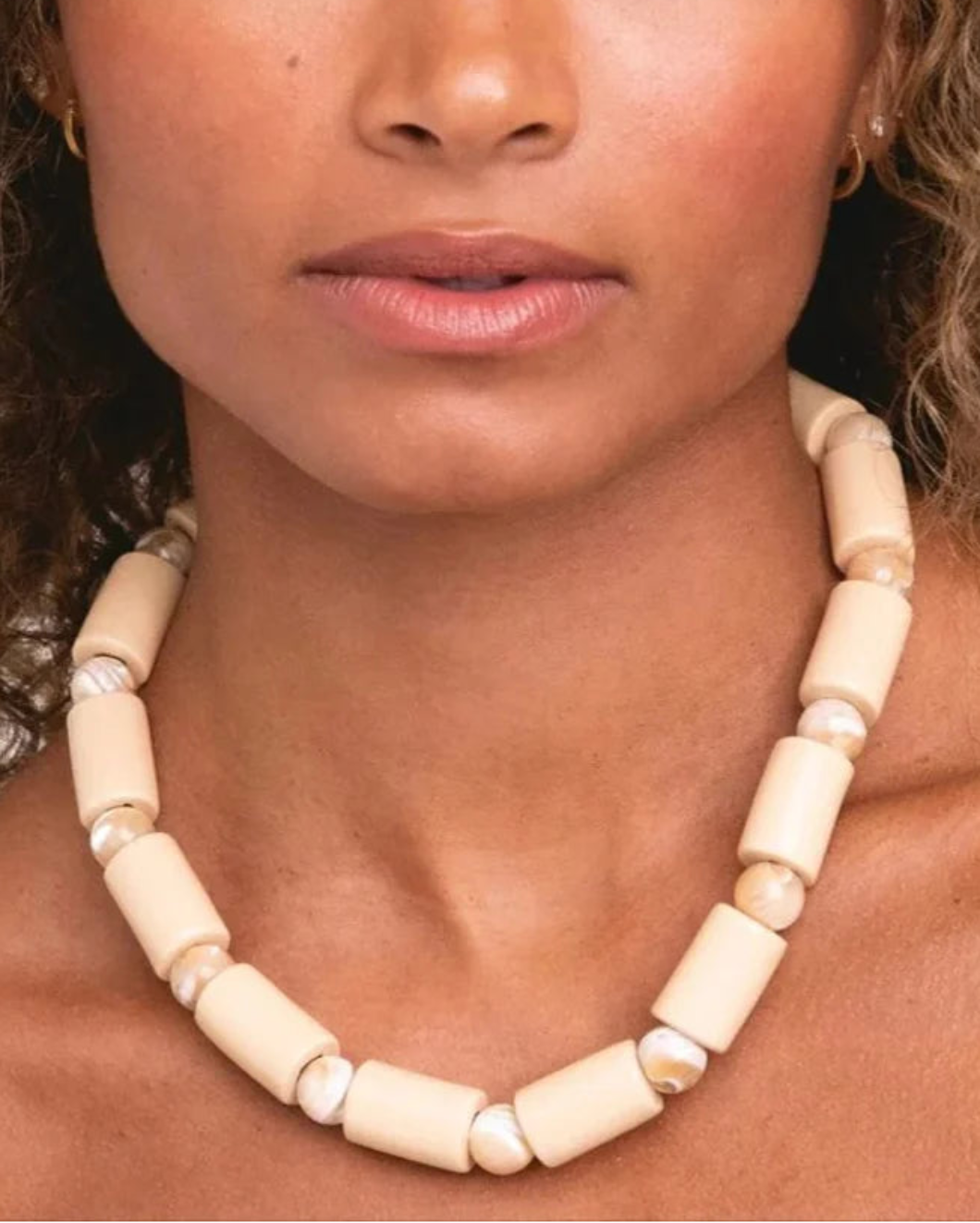 HER NEW TRIBE crepe and conch mother of pearl sundry necklace on figure 