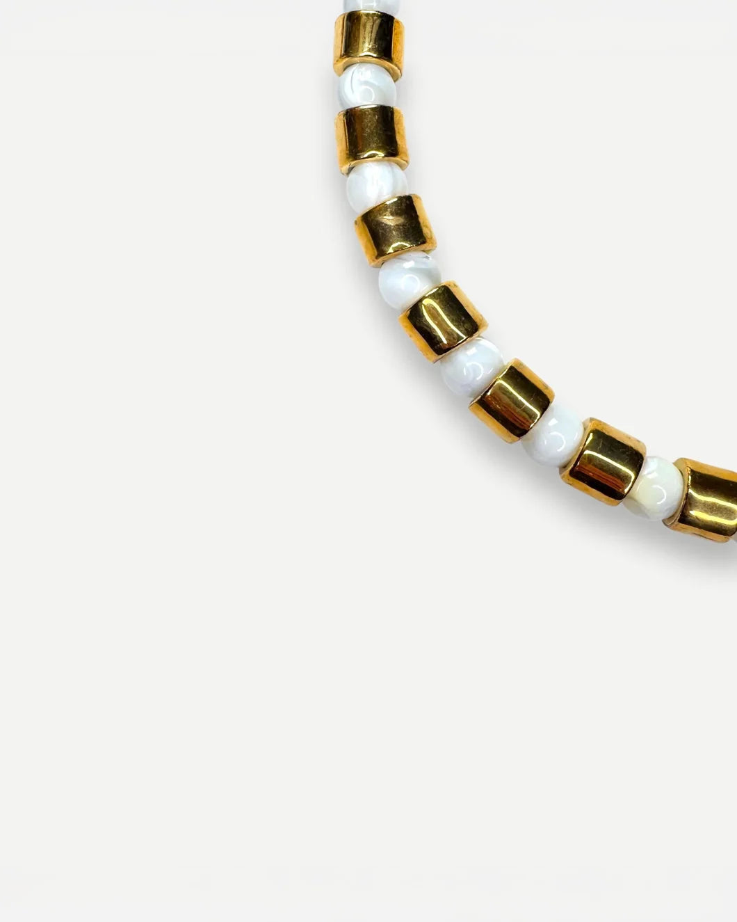 HER NEW TRIBE karat and mother of pearl front detail