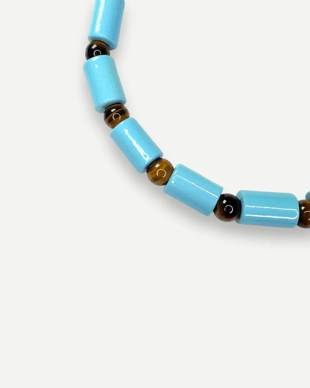 HER NEW TRIBE pool and tigers eye sundry bead five detail