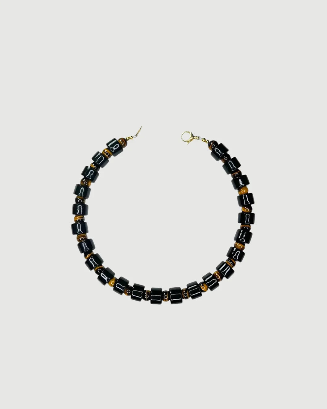 HER NEW TRIBE tap and tigers eye bead two sundry necklace black front isolated