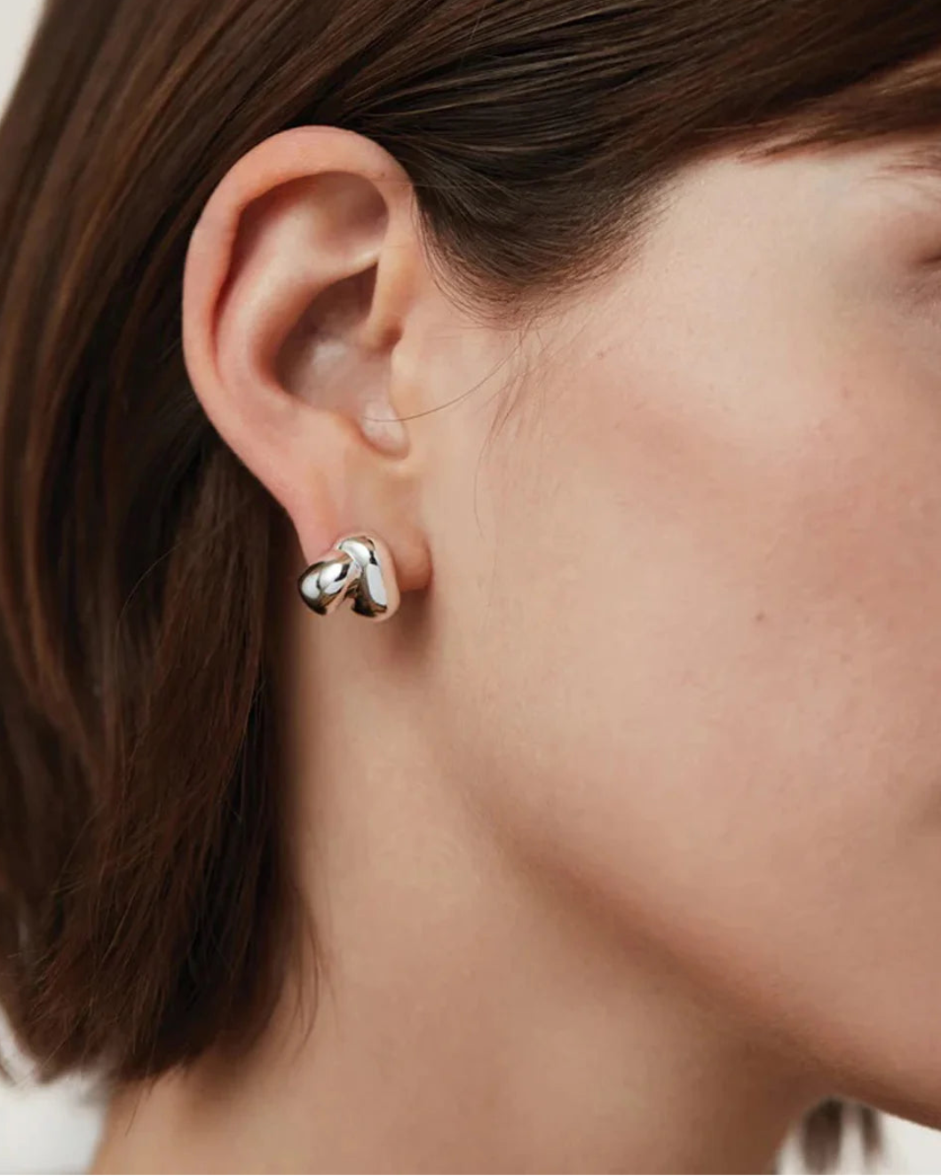 JENNY BIRD Beatrix earrings silver on figure side