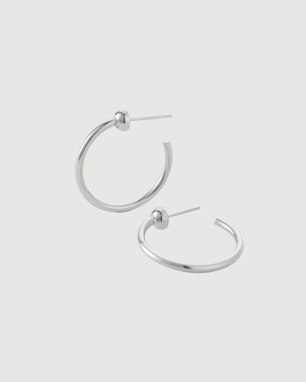 JENNY BIRD mini icon hoops silver isolated