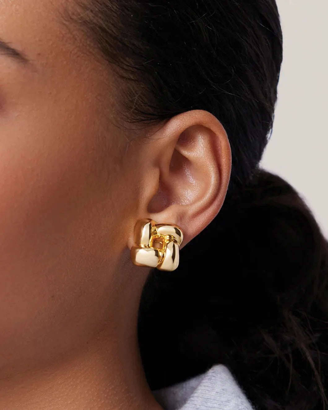JENNY BIRD small woven earrings gold on figure front 1