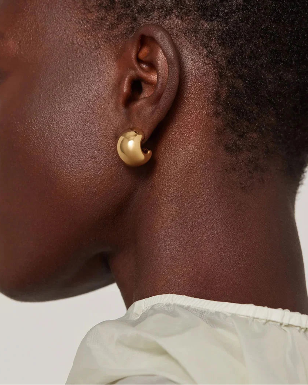 JENNY BIRD small gemma hoop earrings gold on figure back