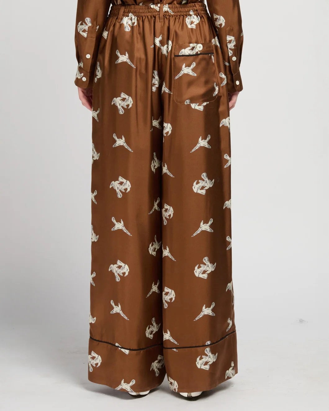 Marni raven print wide leg trousers brown on figure back