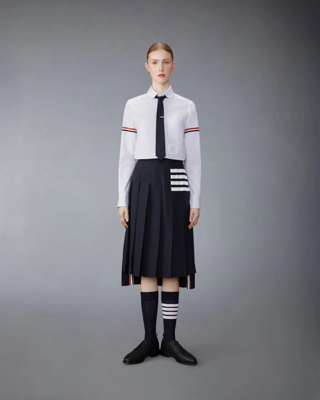 Thom Browne Below Knee Dropped Back Pleated Skirt | SHOWROOM Thom Browne Below Knee Dropped Back Pleated Skirt | SHOWROOM