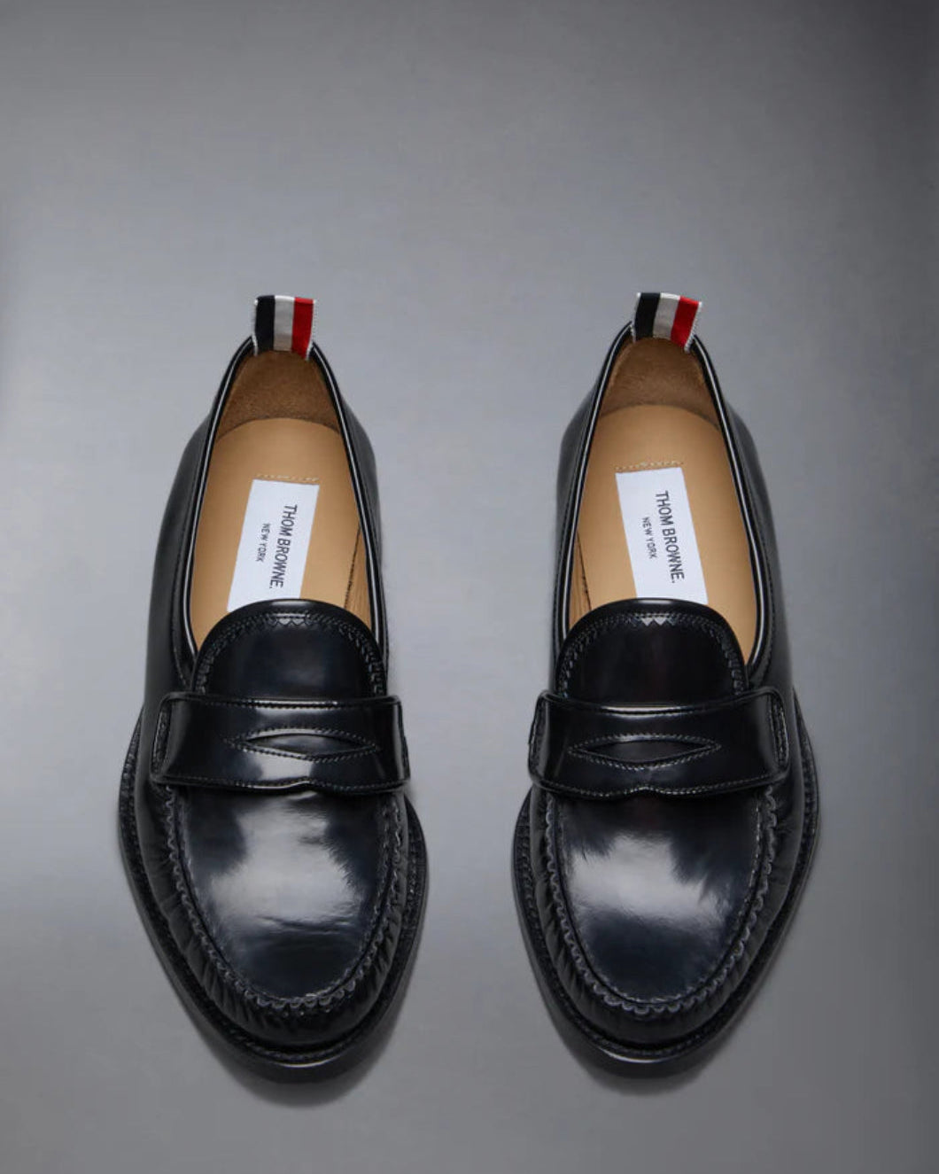THOM BROWNE Spazzolato Pleated Varsity Loafer Black Isolated Front