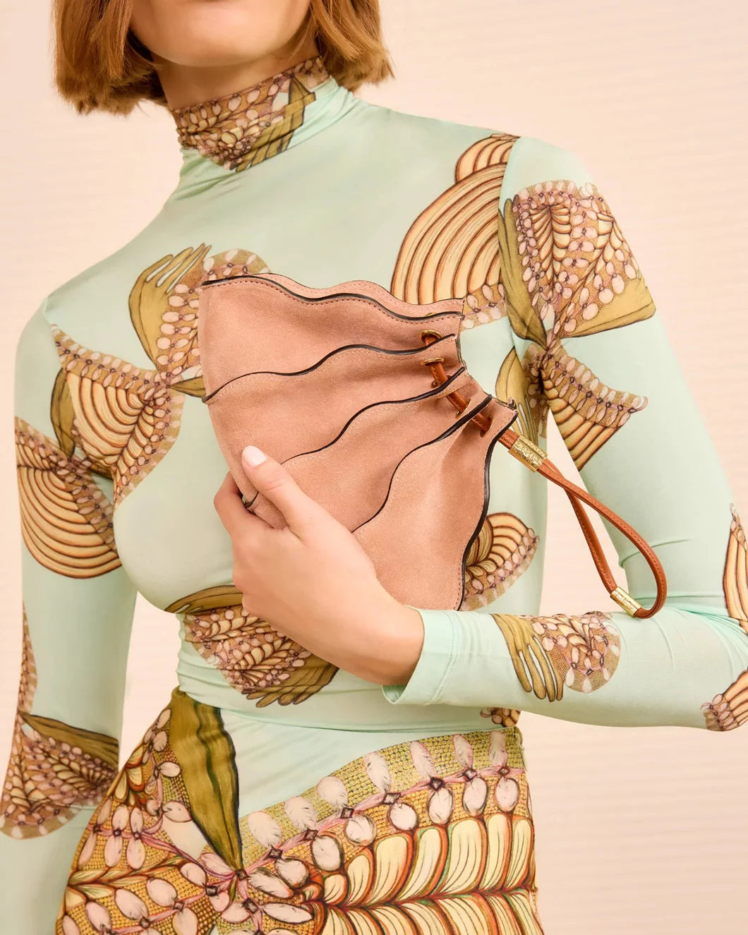 ULLA-JOHNSON-adira-pleated-wave-mini-crossbody-sienna-on-figure-front