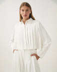 aje Estrade Pleated Crop Shirt ivory white on figure front