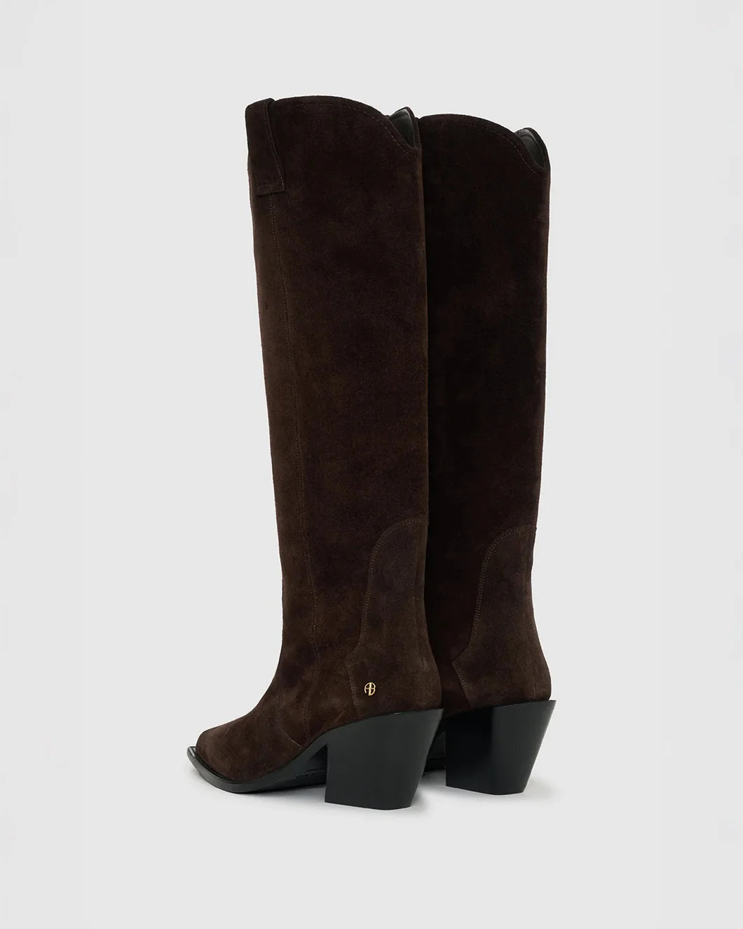pair of anine bing tall tania western boots in dark brown suede shown from the back