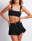     patbo crinkle lurex bikini top black fabric with gold buttons beachwear on figure front detail