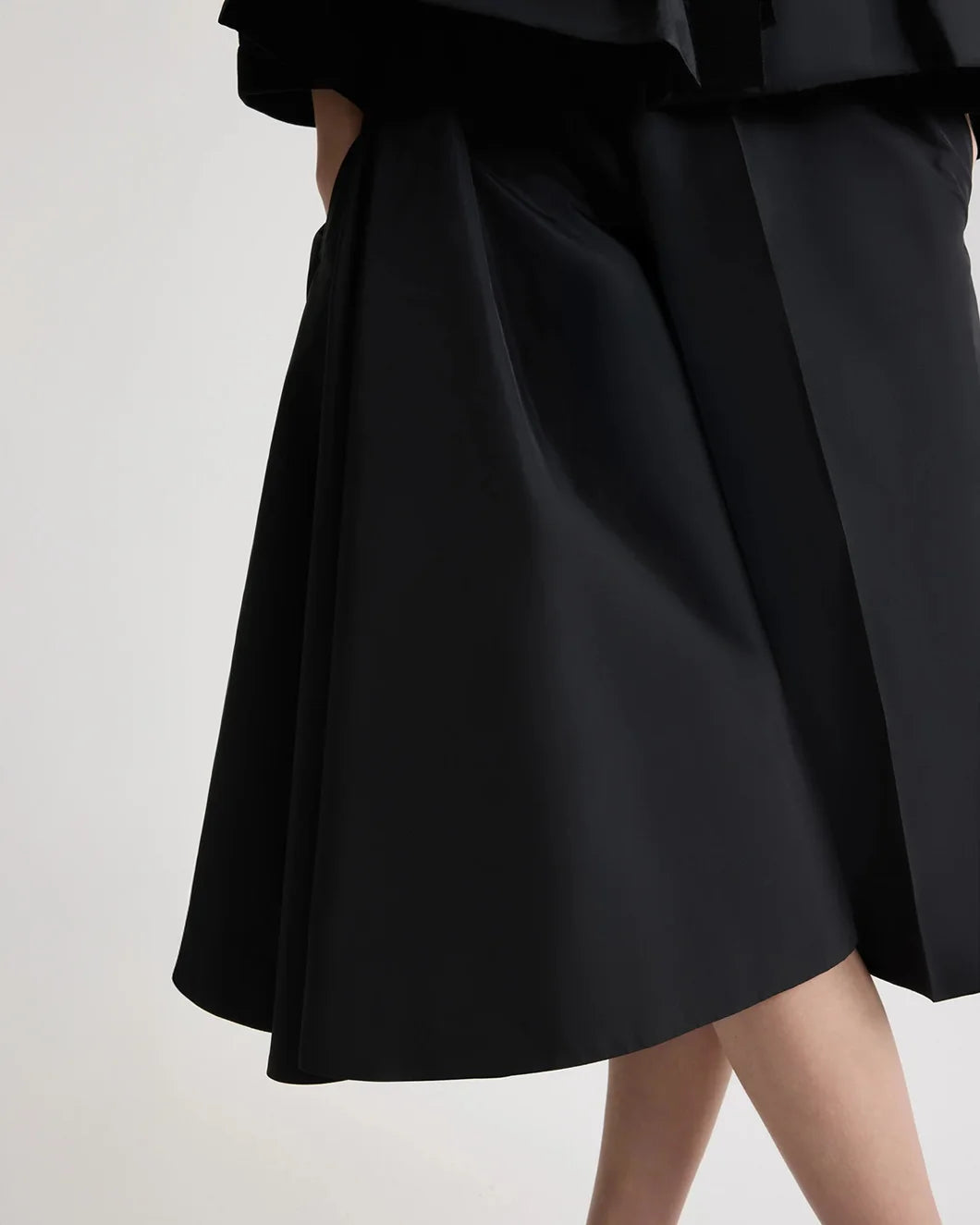 patou asymmetric bermuda shorts in black  recycled faille on model front detail