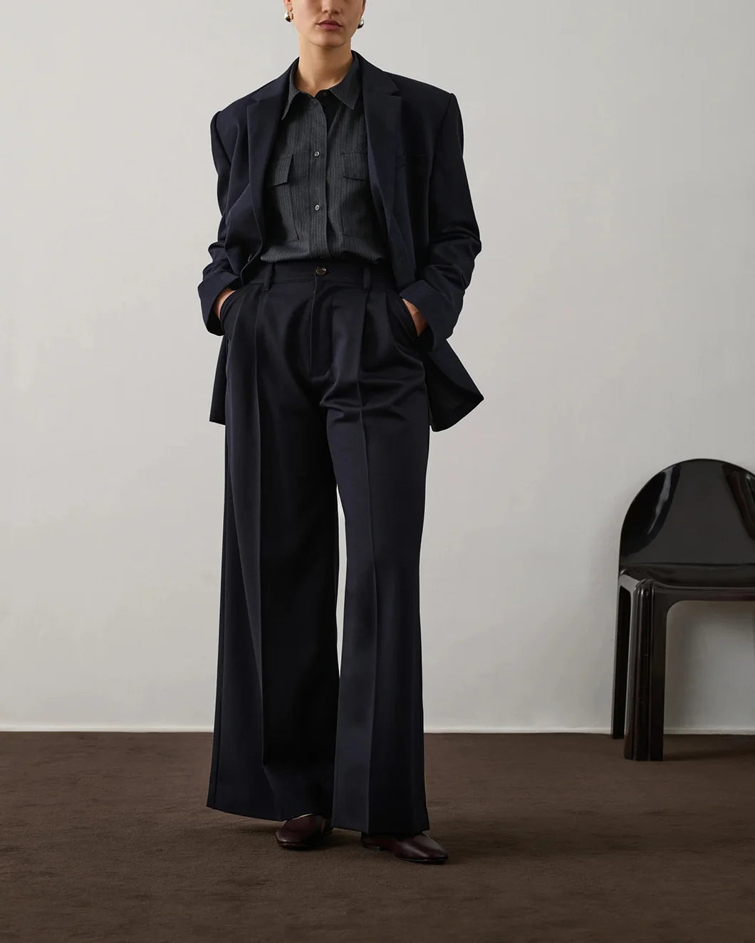 Front view of Soeur Frejus Pants showing elastic waistband and tailored structure with a blazer