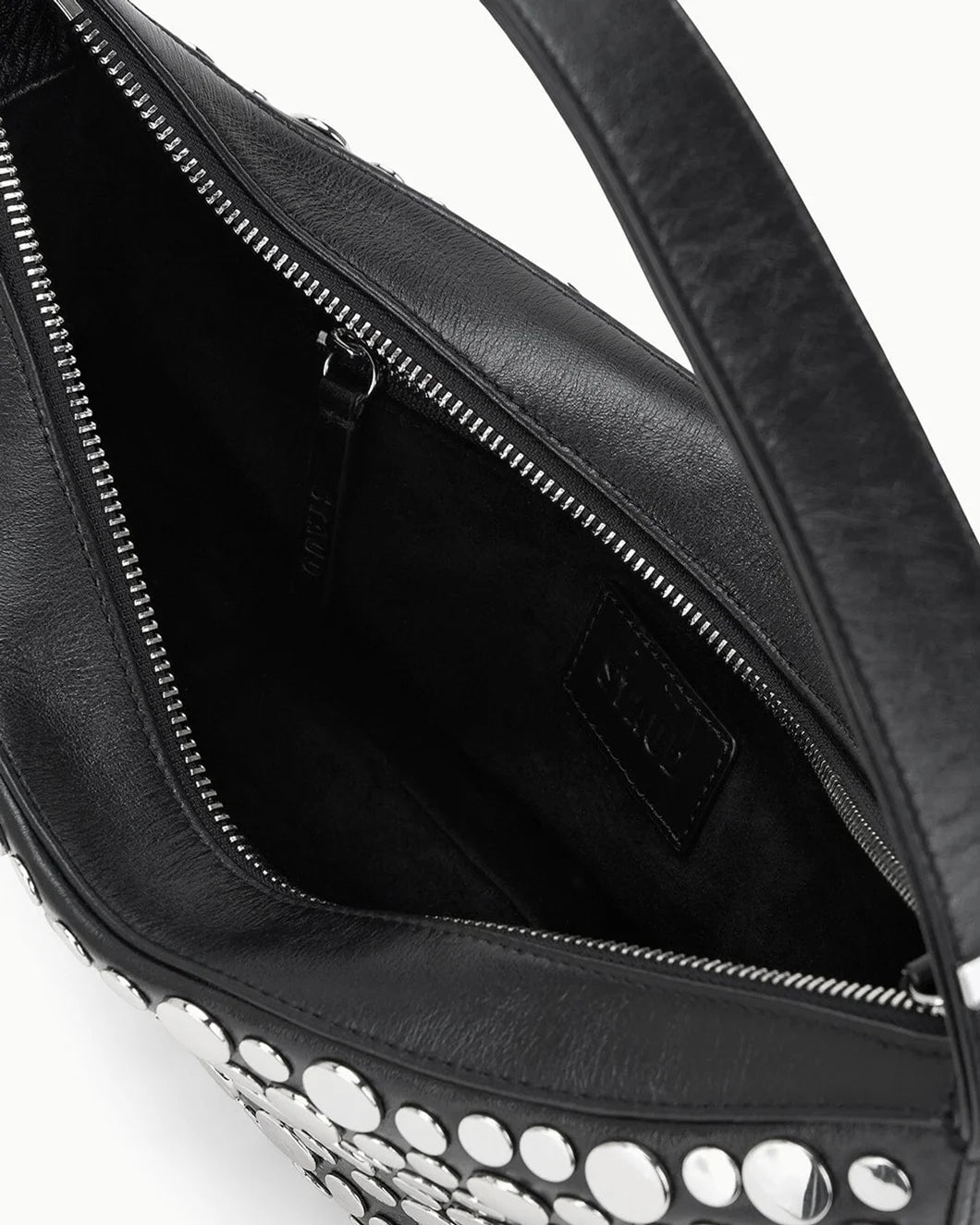 staud demy shoulder bag in black with silver rivets inside view
