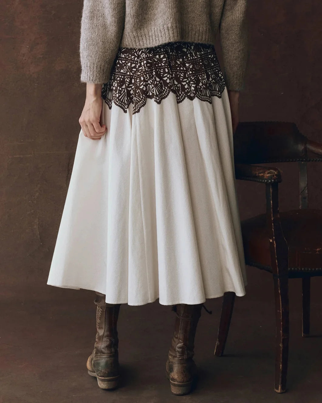 model wearing the Regency Skirt in cream with brown western lace print from the great shown from the back