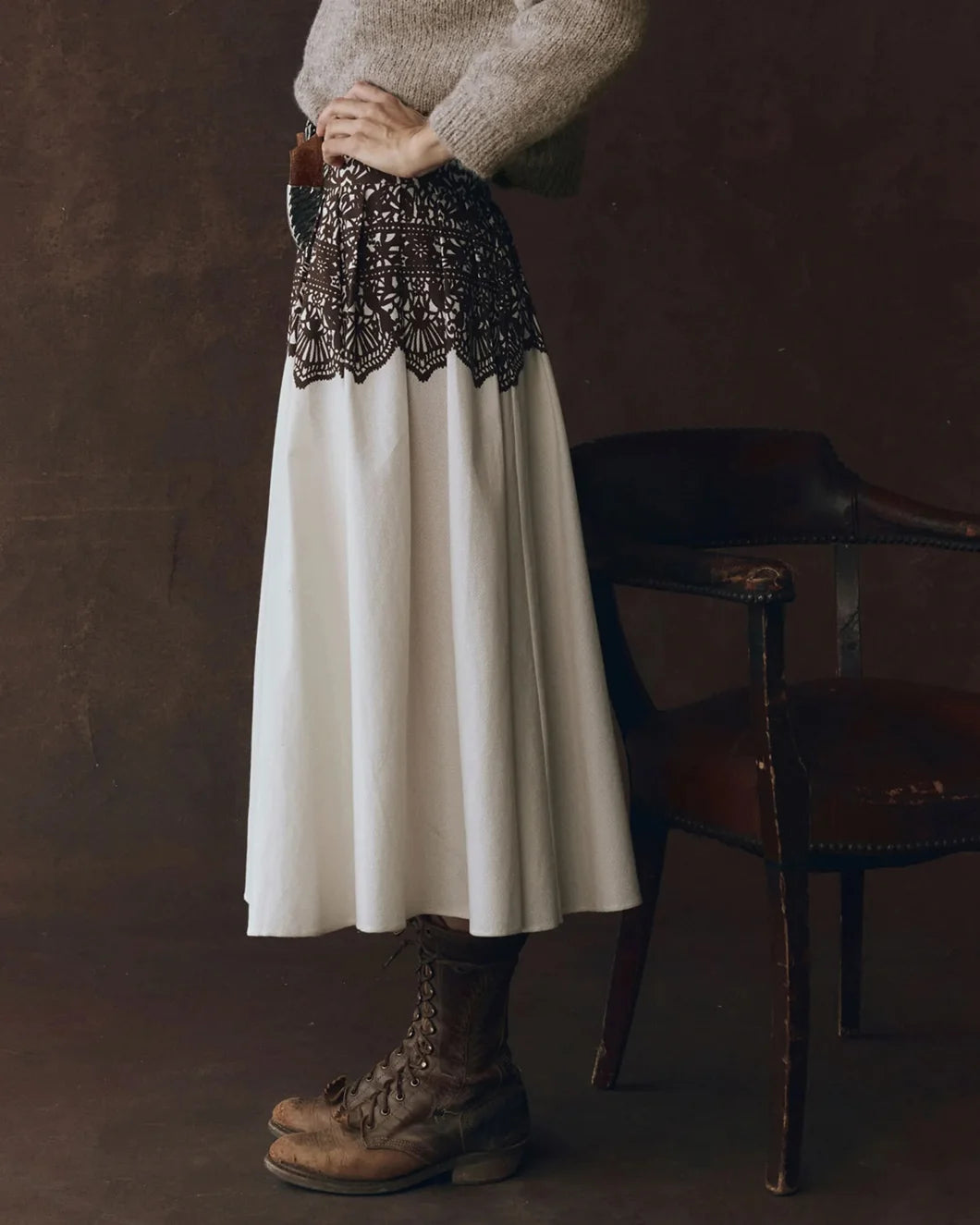 model wearing the Regency Skirt in cream with brown western lace print from the great shown from the side